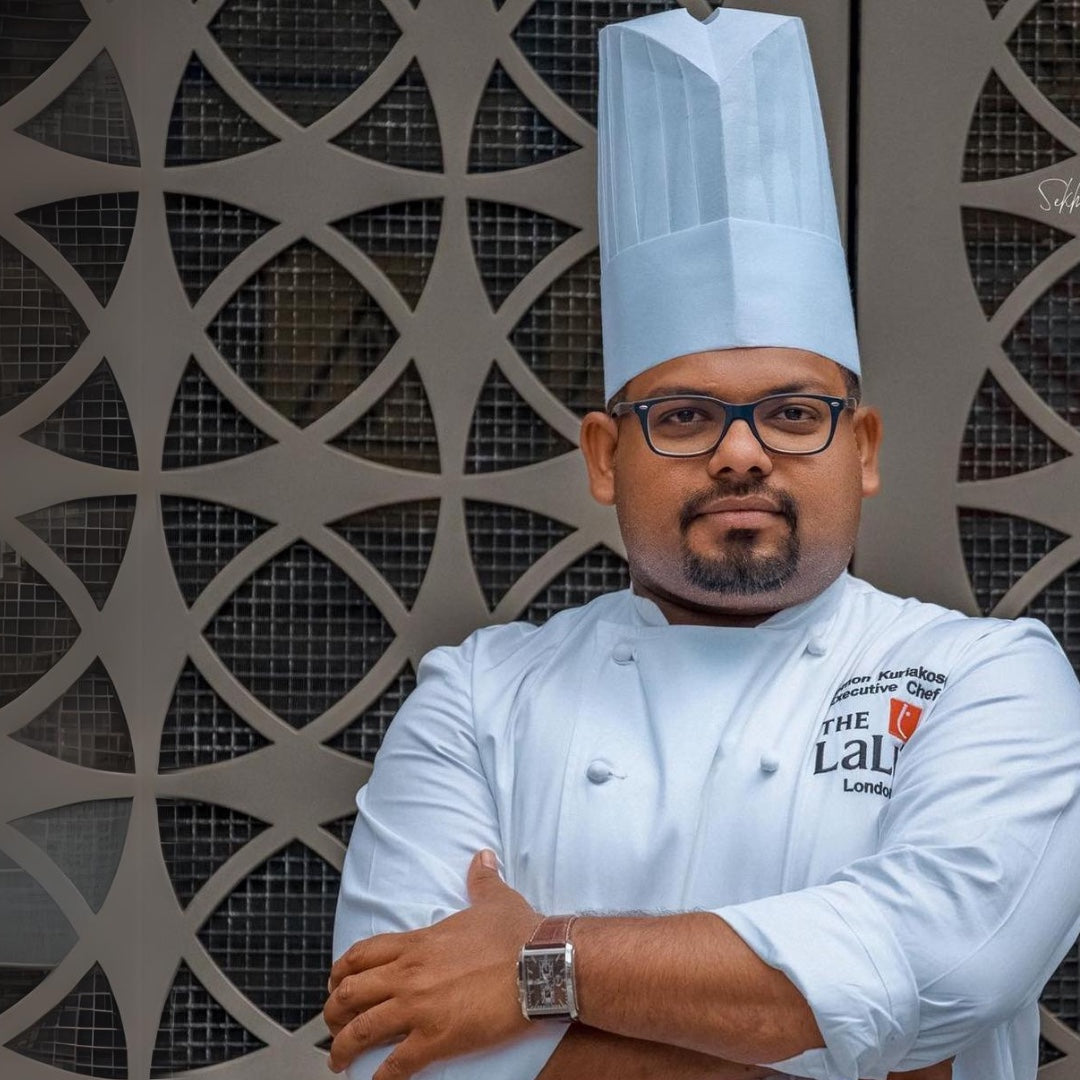 Chef in white uniform with crossed arms